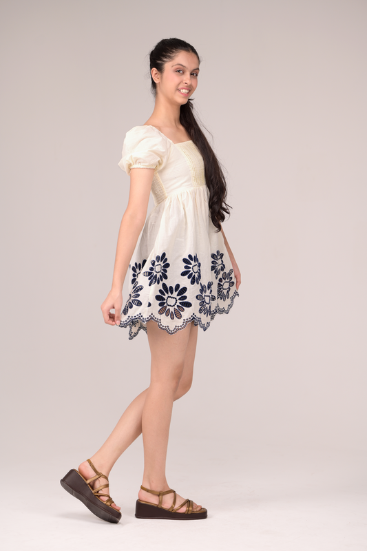 Dress with delicate embroidery blooms