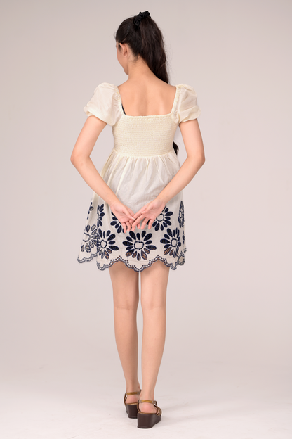 Dress with delicate embroidery blooms