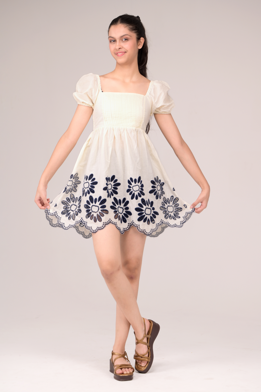 Dress with delicate embroidery blooms