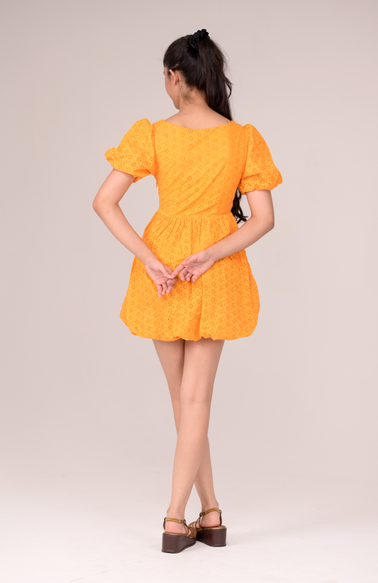 Dress with a fluttering ruffled neckline
