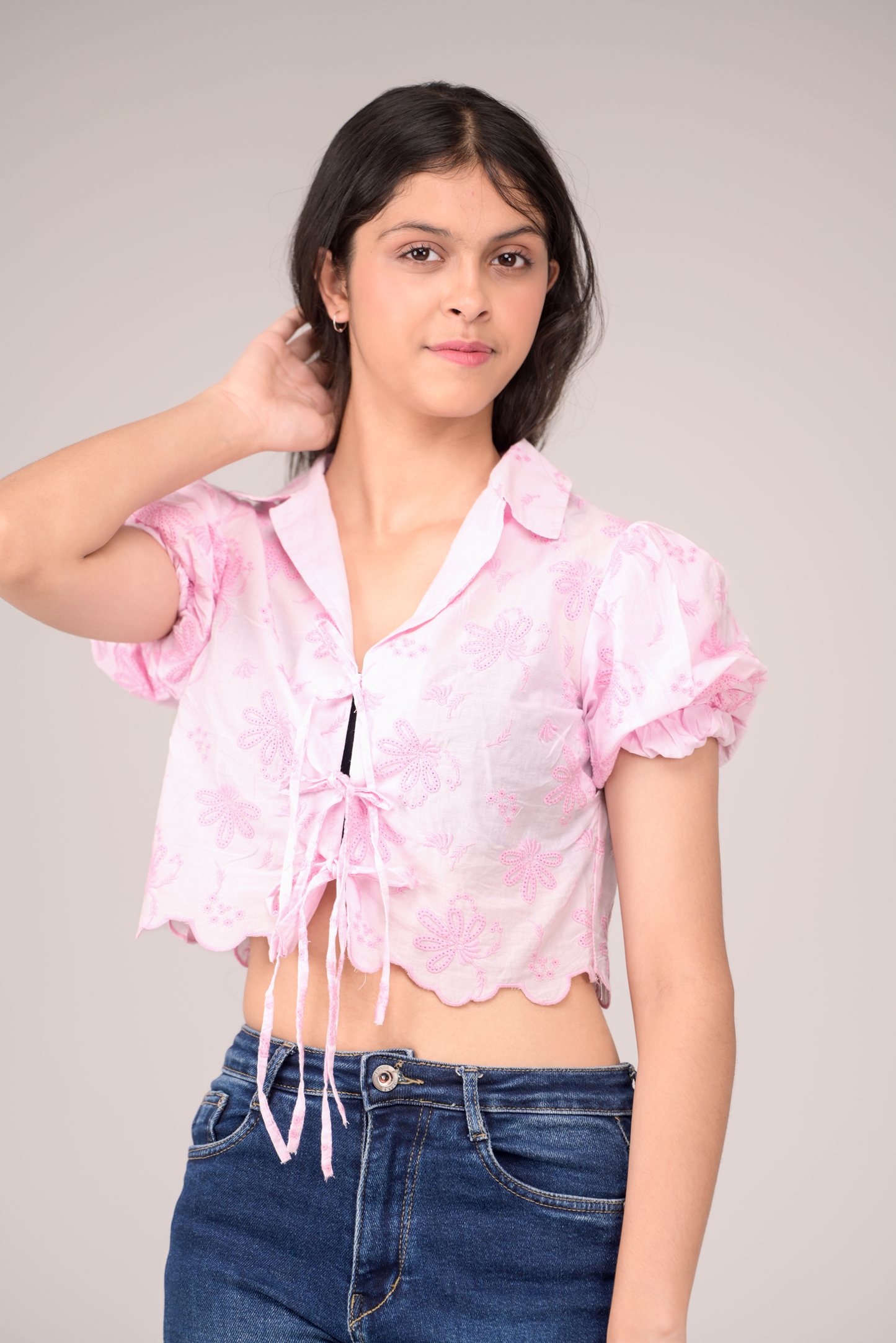 Collared top with a flirty tie knot and puff sleeves